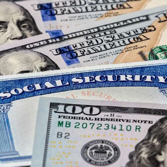 Image of dollar bills and a social security card.