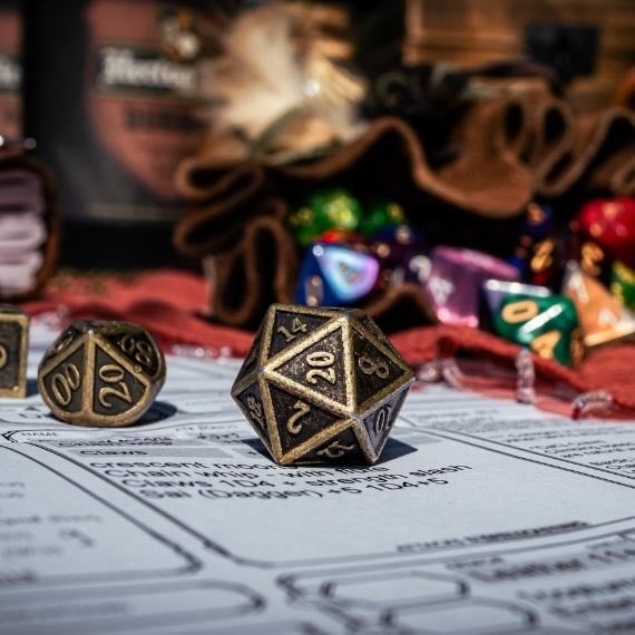 Assortment of dice on top of a Dungeons and Dragons board.