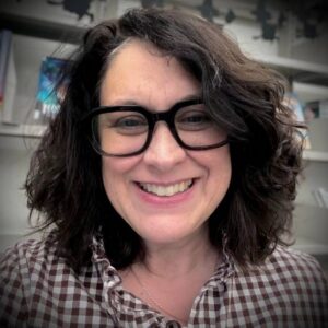 Selfie of a woman with dark hair and glasses